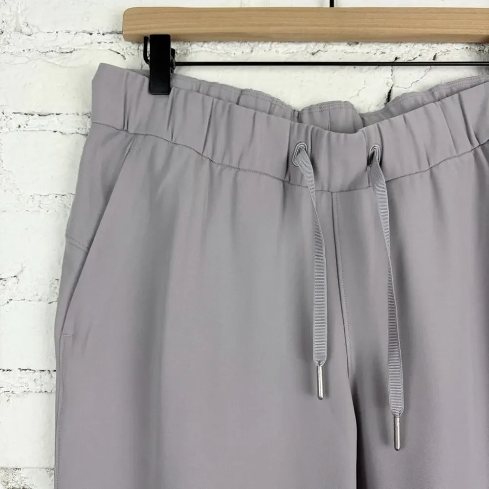 Lululemon On the Fly 7/8 Pants Woven Carbon Dust Tan Grey 8